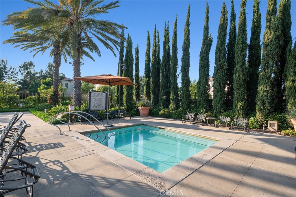 84 Granite Path Irvine, CA 92620 - Photo 49 of 55 a view of a backyard with swimming pool and sitting area
