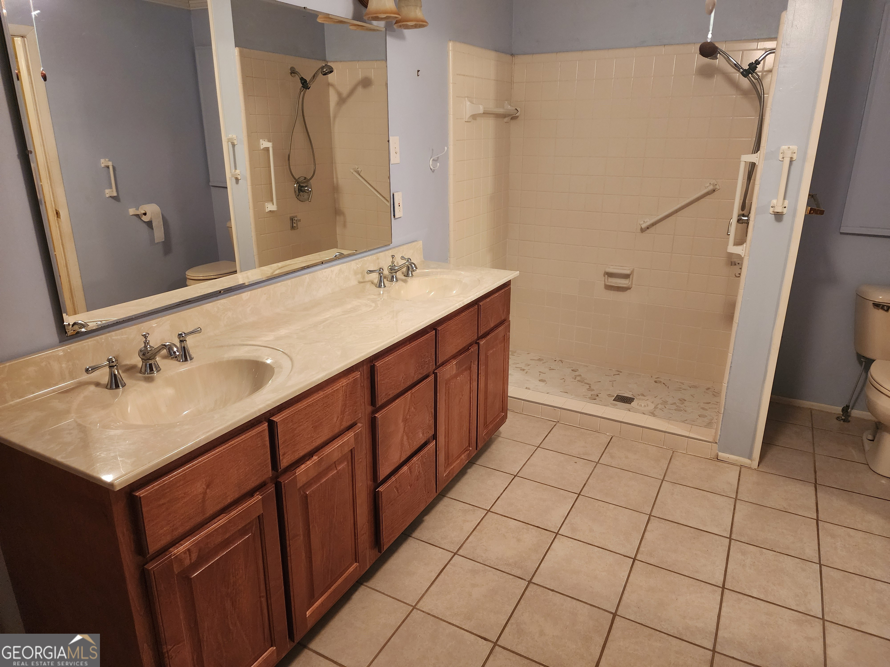 210 Penn Avenue Dublin, GA 31021 - Photo 14 of 17 a bathroom with a sink toilet and shower