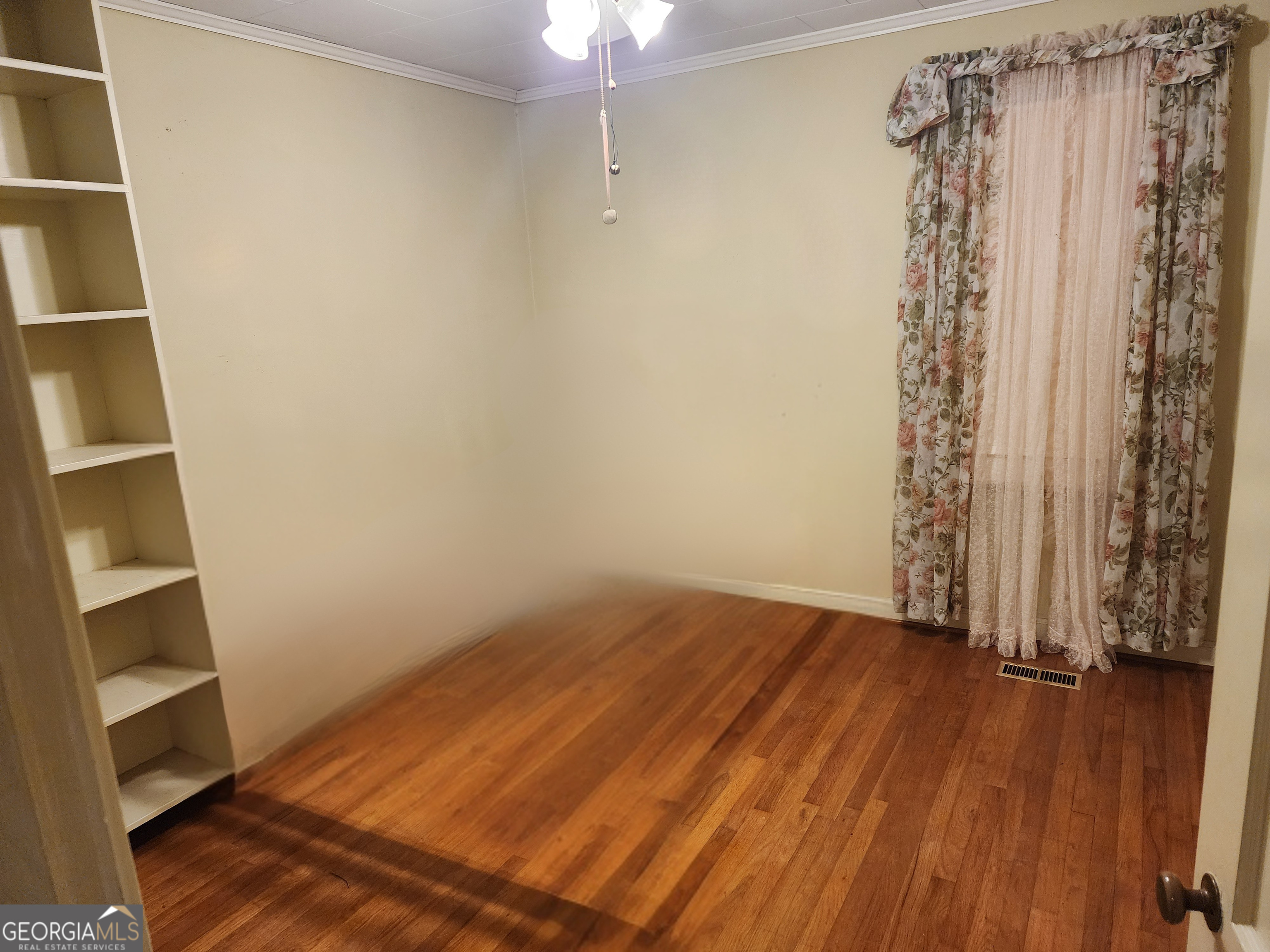 210 Penn Avenue Dublin, GA 31021 - Photo 16 of 17 a view of a room with wooden floor and balcony