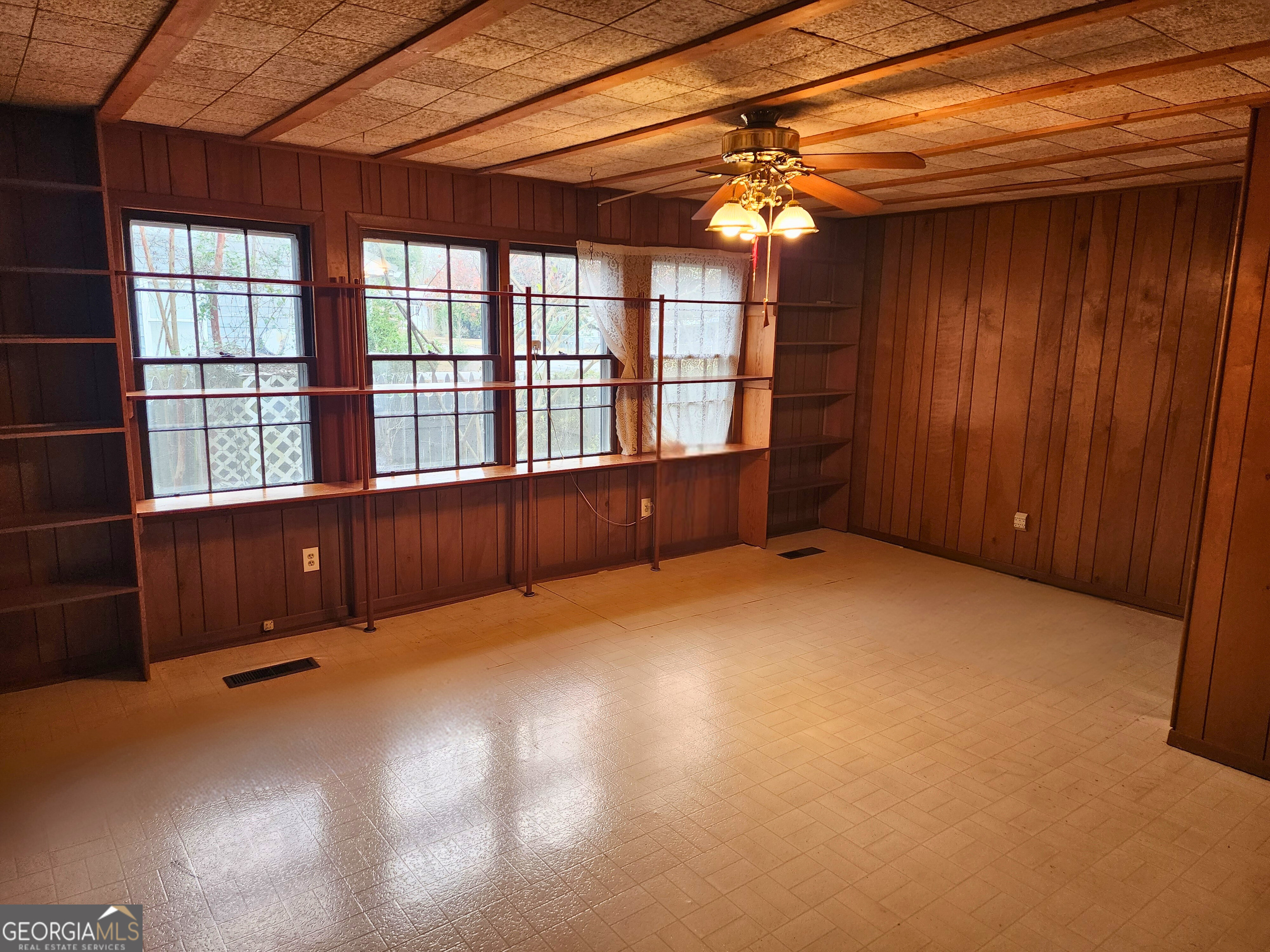 210 Penn Avenue Dublin, GA 31021 - Photo 4 of 17 a view of an empty room with a window