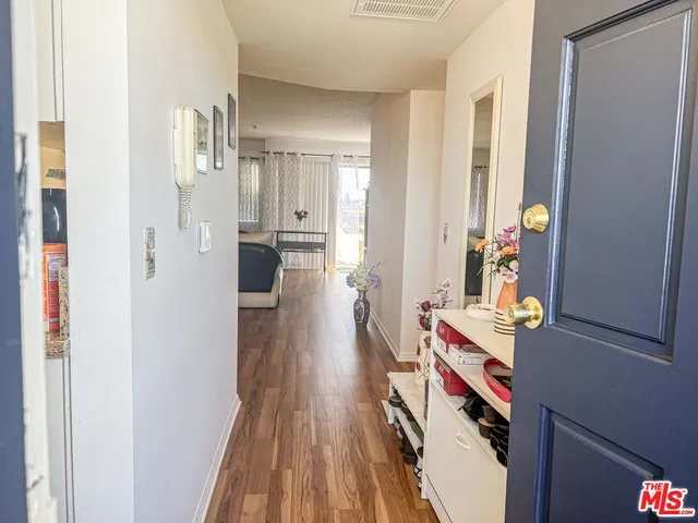 a hallway with wooden floor
