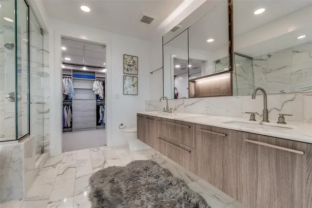 a large bathroom with a sink and a mirror