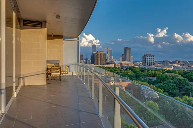 a lobby with furniture and a potted plant