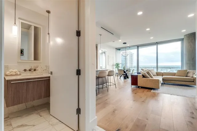 a living room with furniture and wooden floor
