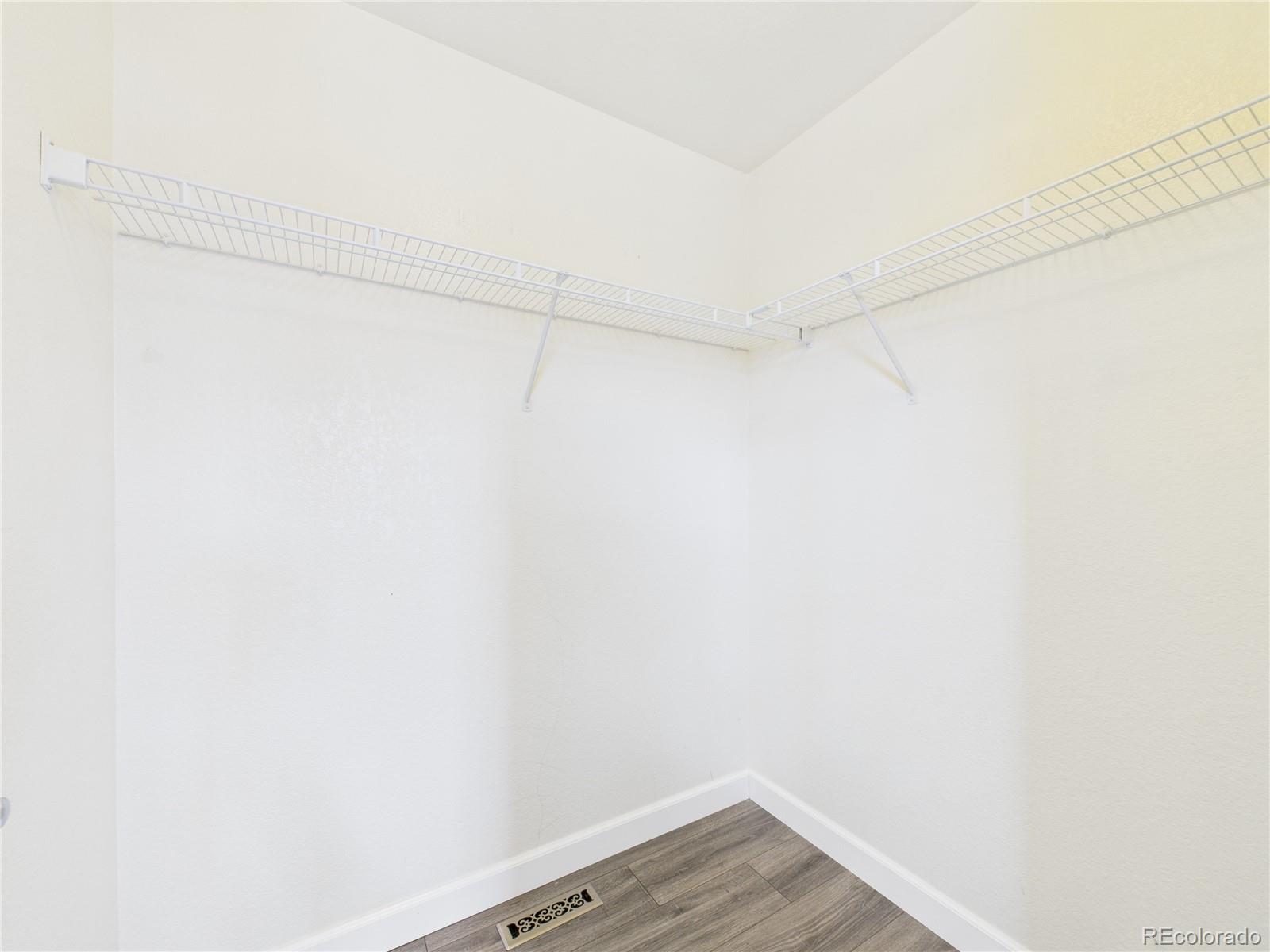 10501 Wagon Highlands Ranch Highlands Ranch, CO 80130 - Photo 23 of 50 a view of a room with wooden floor