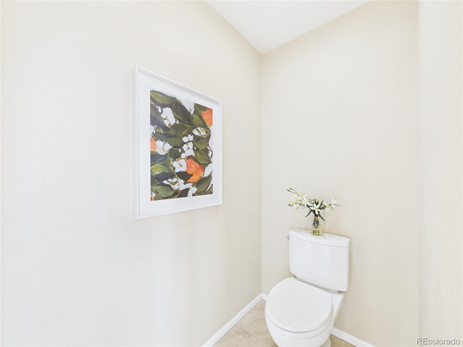 10501 Wagon Highlands Ranch Highlands Ranch, CO 80130 - Photo 30 of 50 a white toilet sitting next to a white walls