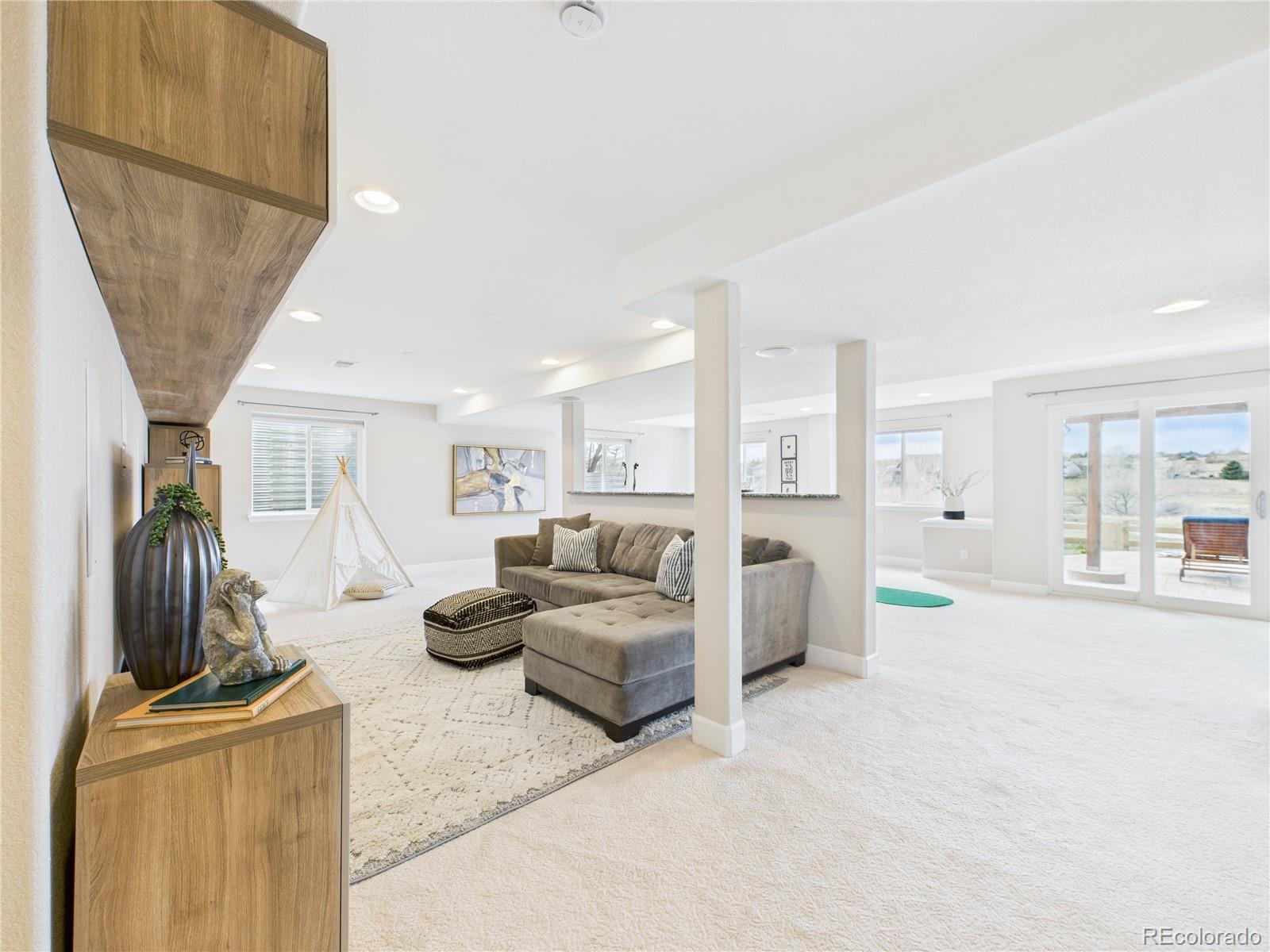 10501 Wagon Highlands Ranch Highlands Ranch, CO 80130 - Photo 32 of 50 a bedroom with furniture and a window