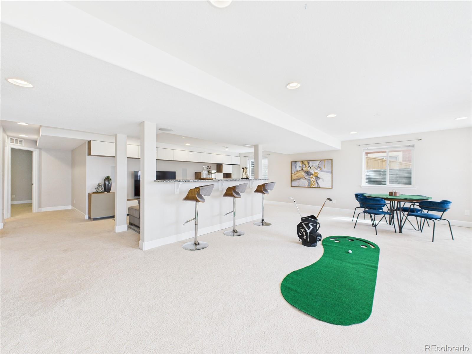 10501 Wagon Highlands Ranch Highlands Ranch, CO 80130 - Photo 34 of 50 a view of a livingroom with furniture and a table