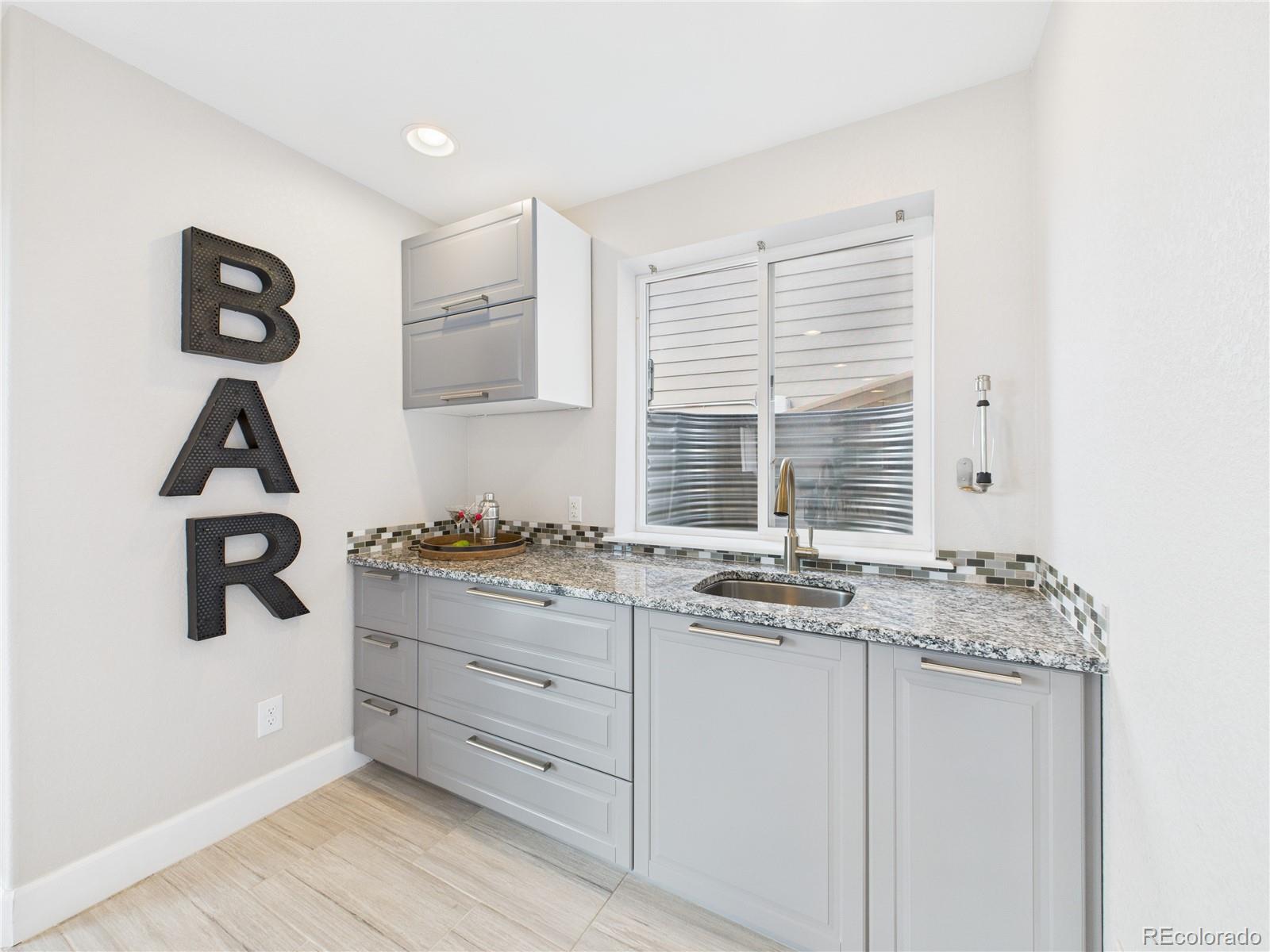 10501 Wagon Highlands Ranch Highlands Ranch, CO 80130 - Photo 35 of 50 a kitchen with stainless steel appliances granite countertop a stove and a sink