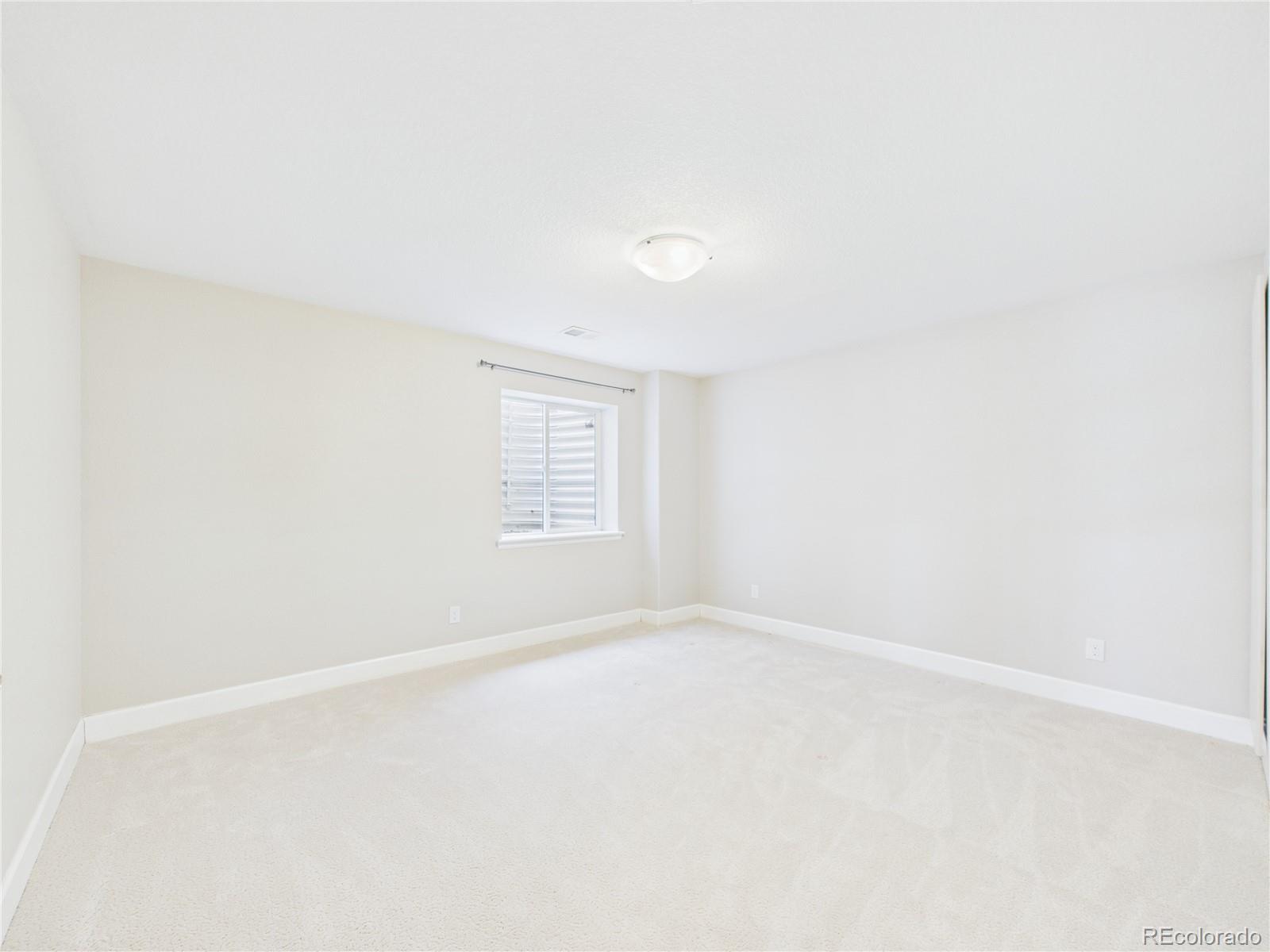 10501 Wagon Highlands Ranch Highlands Ranch, CO 80130 - Photo 38 of 50 a view of an empty room with a window
