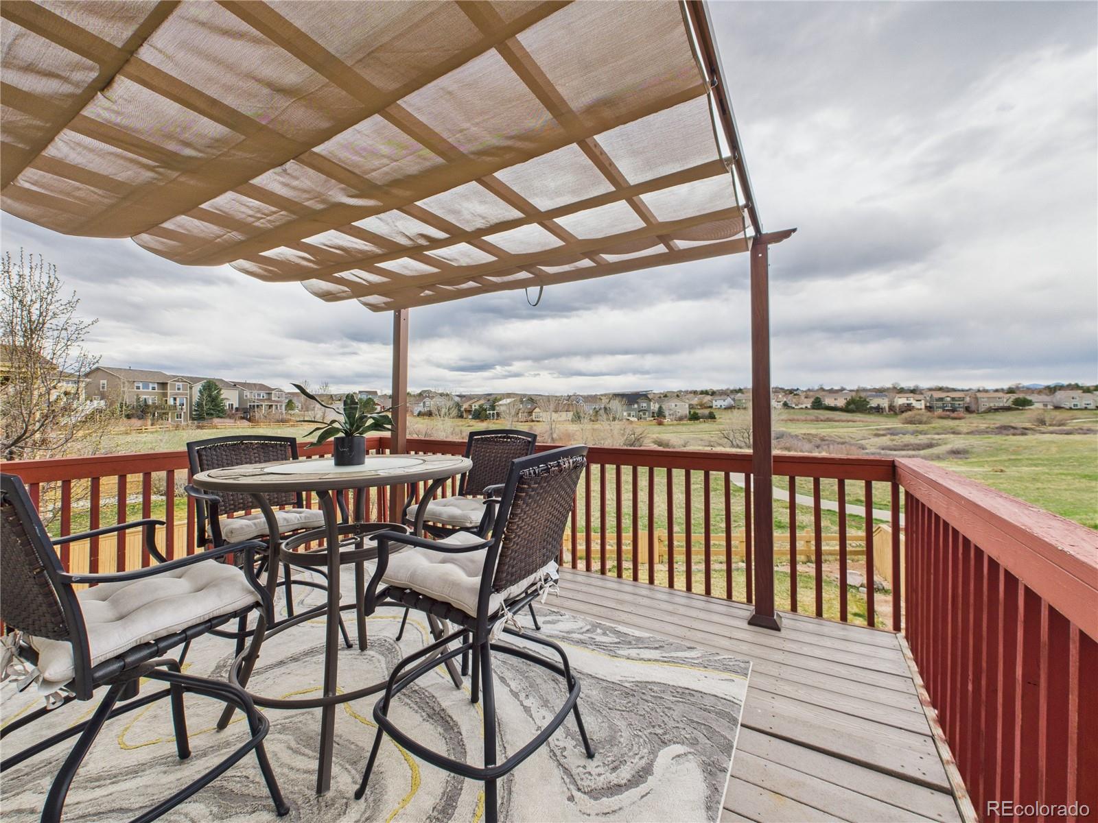 10501 Wagon Highlands Ranch Highlands Ranch, CO 80130 - Photo 40 of 50 a view of a balcony with furniture