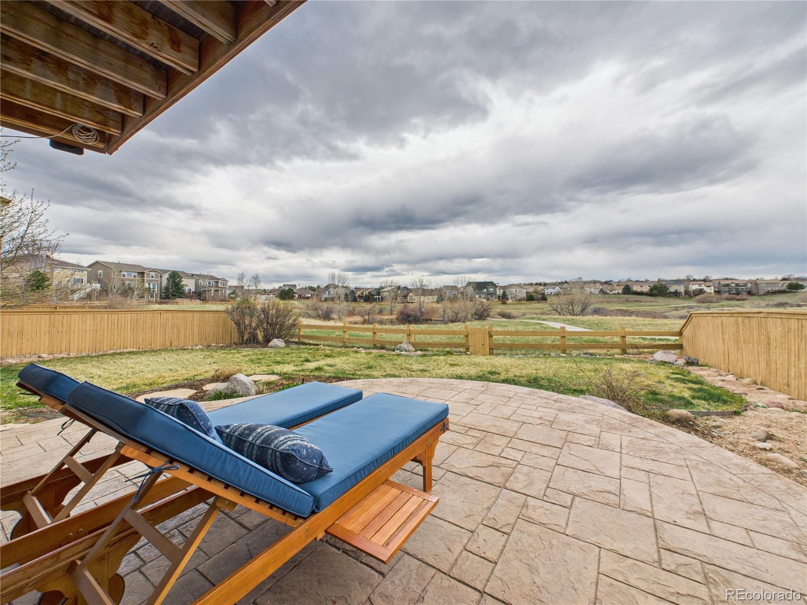 10501 Wagon Highlands Ranch Highlands Ranch, CO 80130 - Photo 42 of 50 an outdoor space with lounge chair