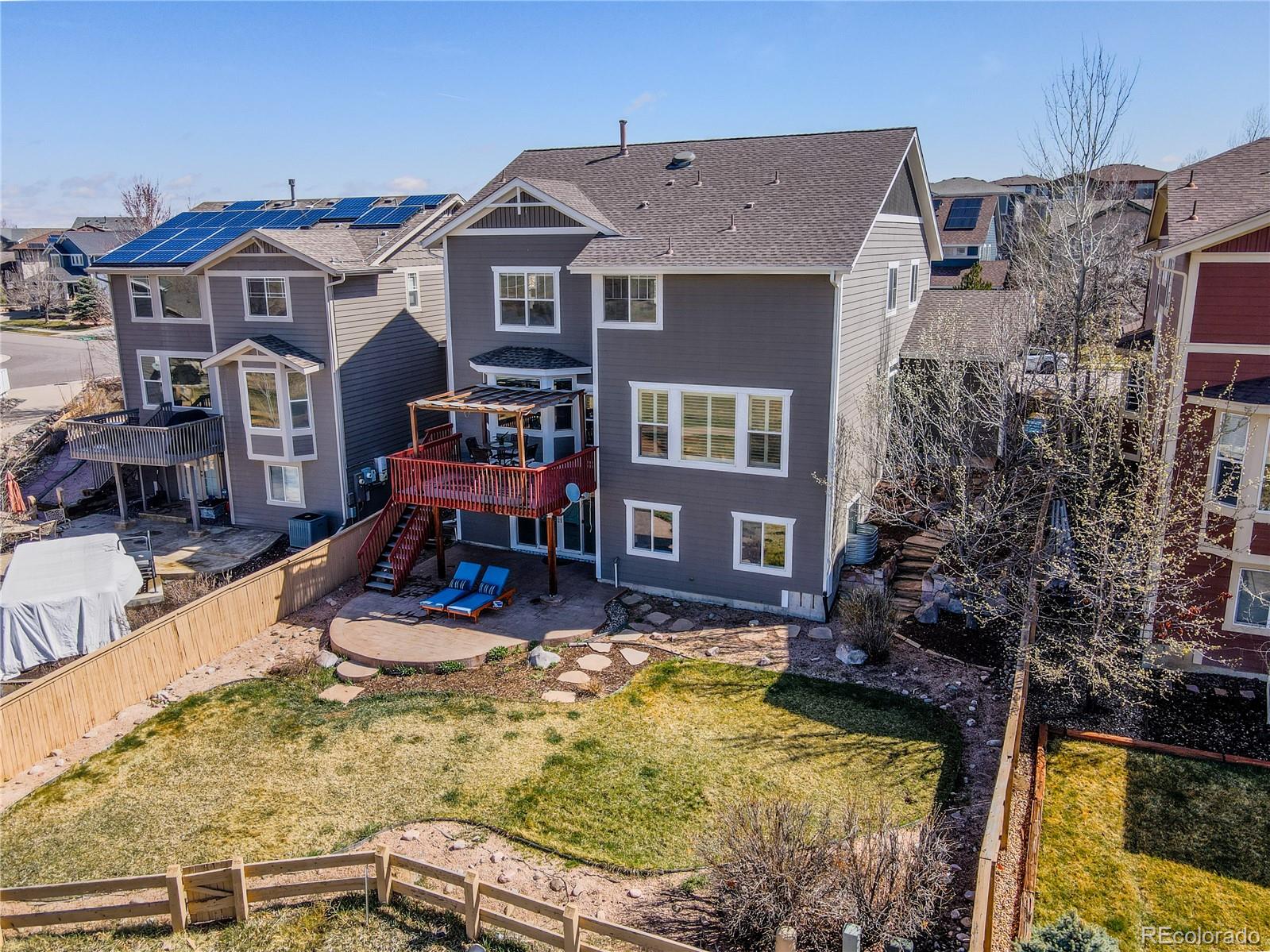 10501 Wagon Highlands Ranch Highlands Ranch, CO 80130 - Photo 47 of 50 a view of a house with swimming pool and sitting area