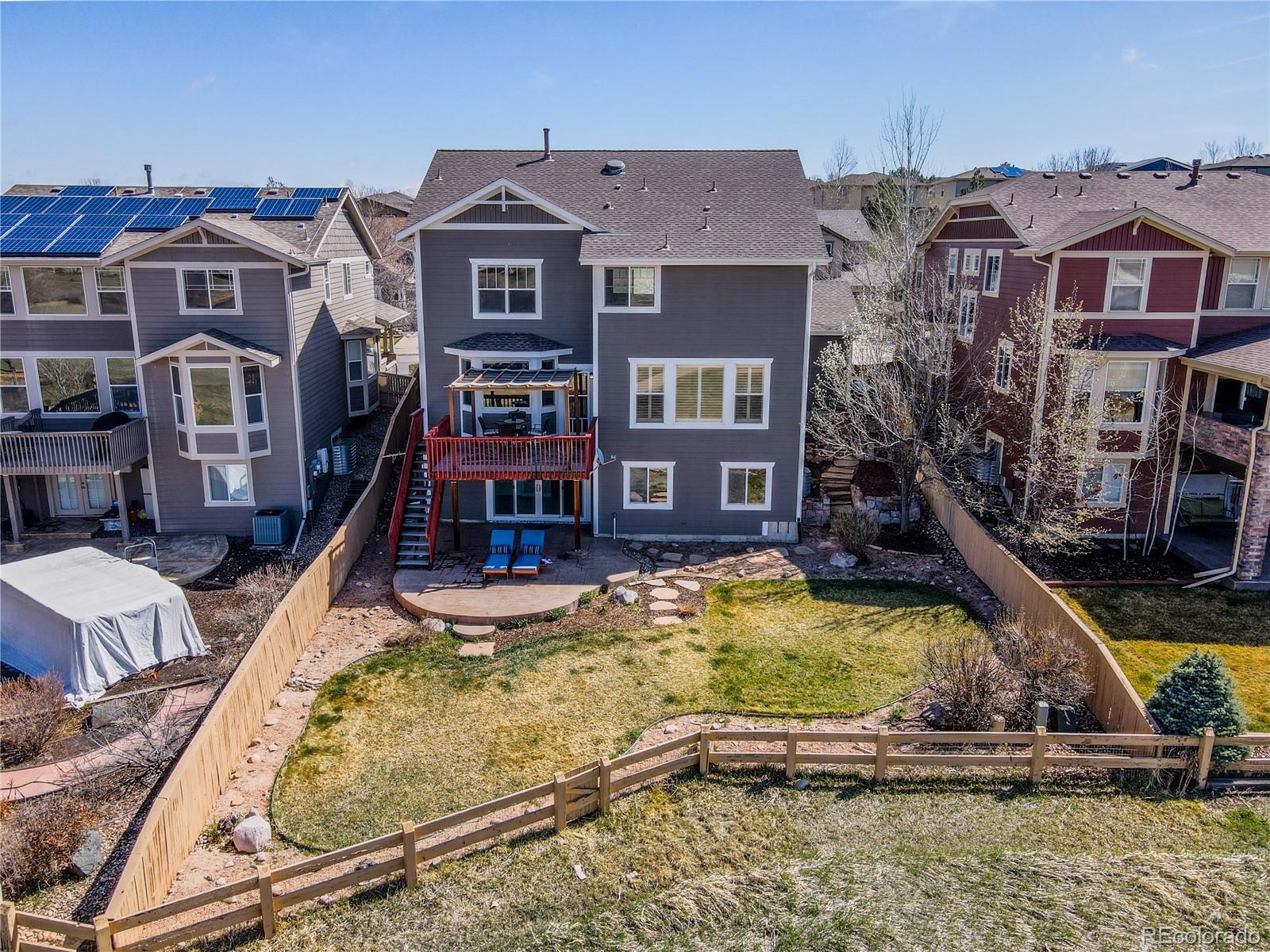 10501 Wagon Highlands Ranch Highlands Ranch, CO 80130 - Photo 49 of 50 a front view of a house with swimming pool
