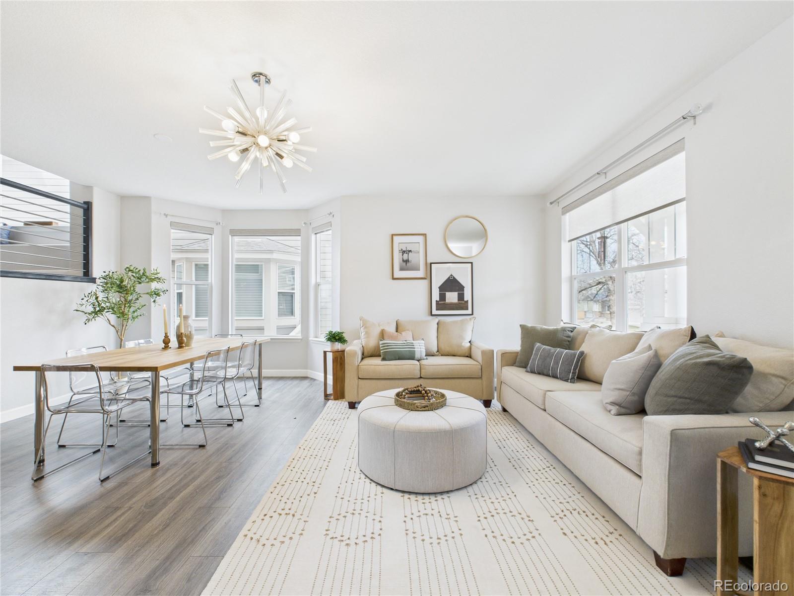 10501 Wagon Highlands Ranch Highlands Ranch, CO 80130 - Photo 6 of 50 a living room with furniture and a large window