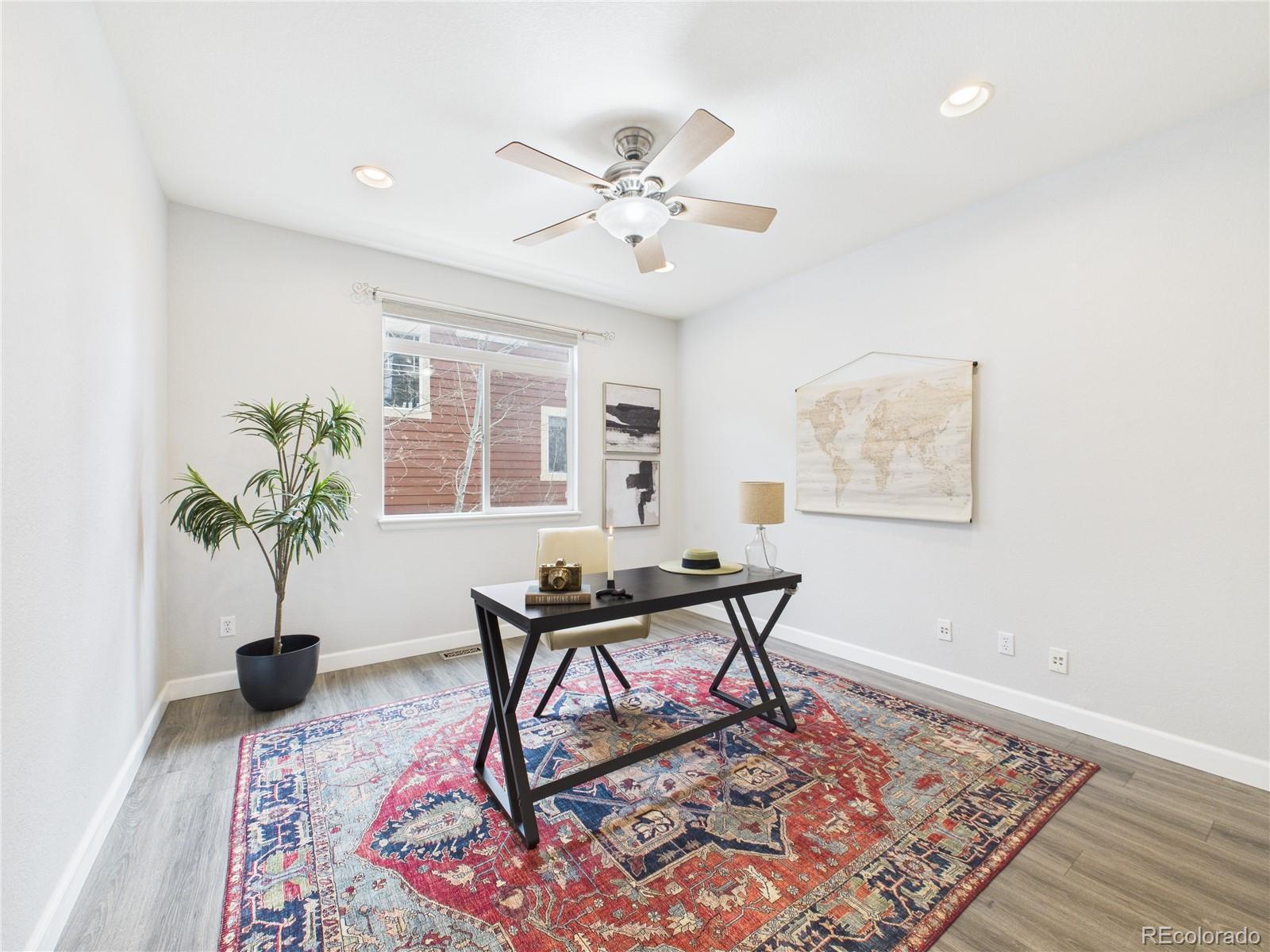 10501 Wagon Highlands Ranch Highlands Ranch, CO 80130 - Photo 8 of 50 a living room with furniture and a potted plant