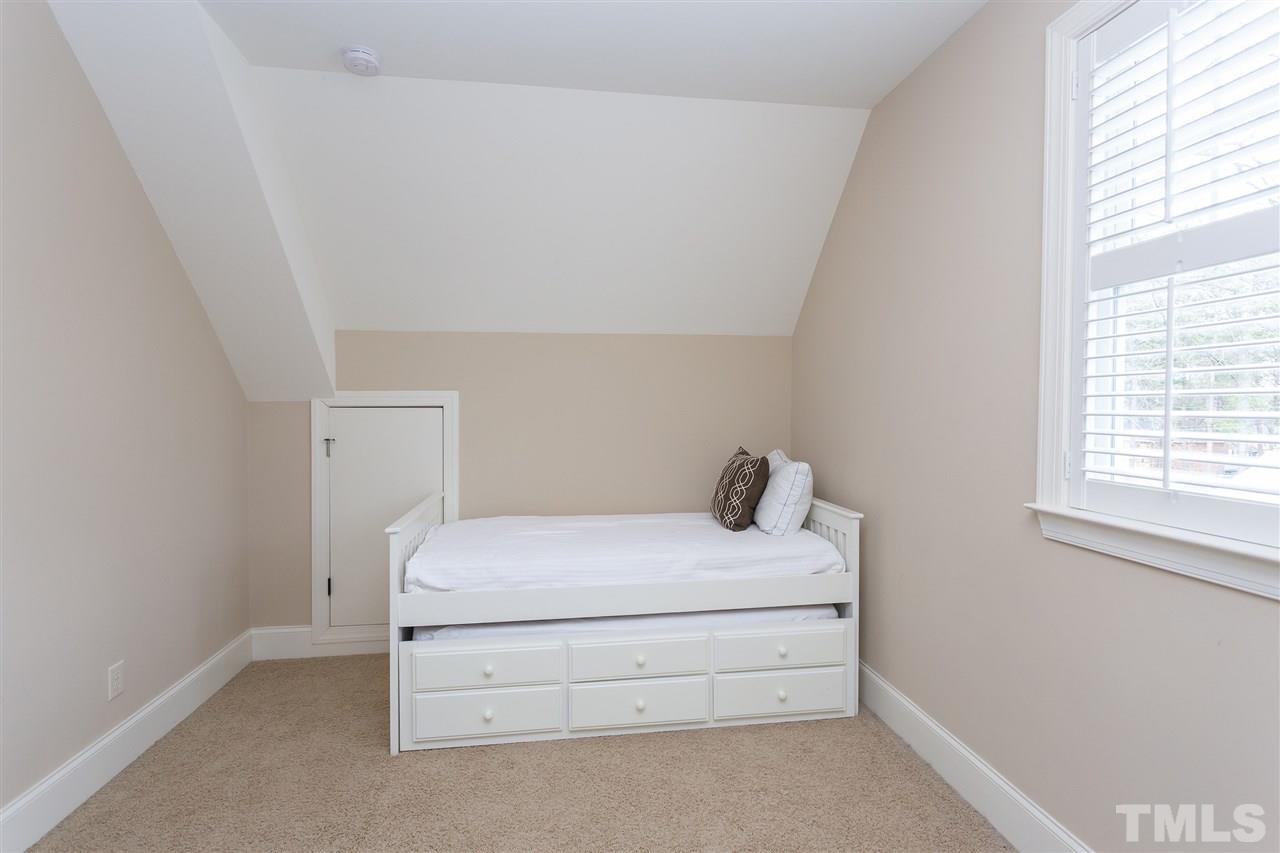 1907 Carroll Drive Raleigh, NC 27608 - Photo 22 of 30 a room with a bed and a window