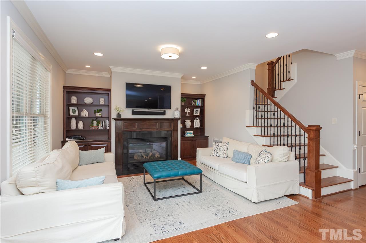 1907 Carroll Drive Raleigh, NC 27608 - Photo 8 of 30 a living room with fireplace furniture and a flat screen tv