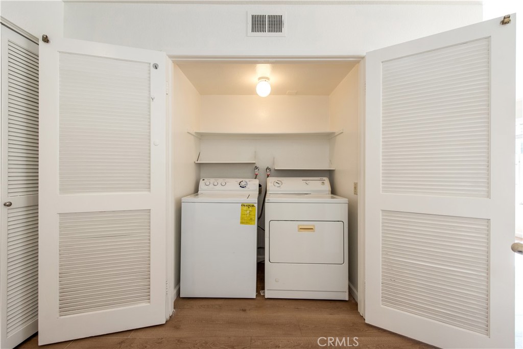 28 Exeter, Unit 19 Irvine, CA 92612 - Photo 11 of 35 a utility room with dryer and washer
