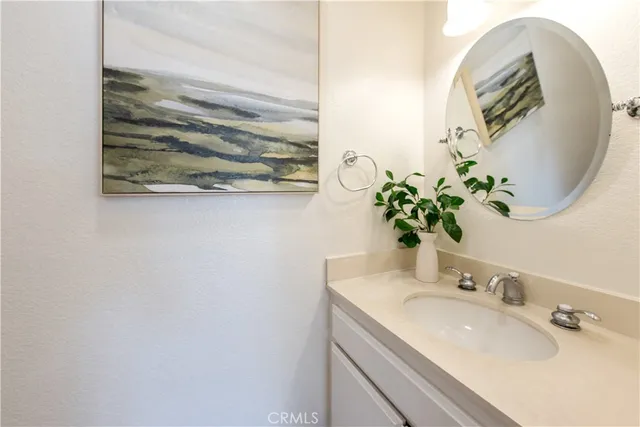 a bathroom with a sink and mirror