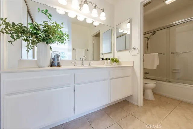 a bathroom with a sink a toilet and a bathtub
