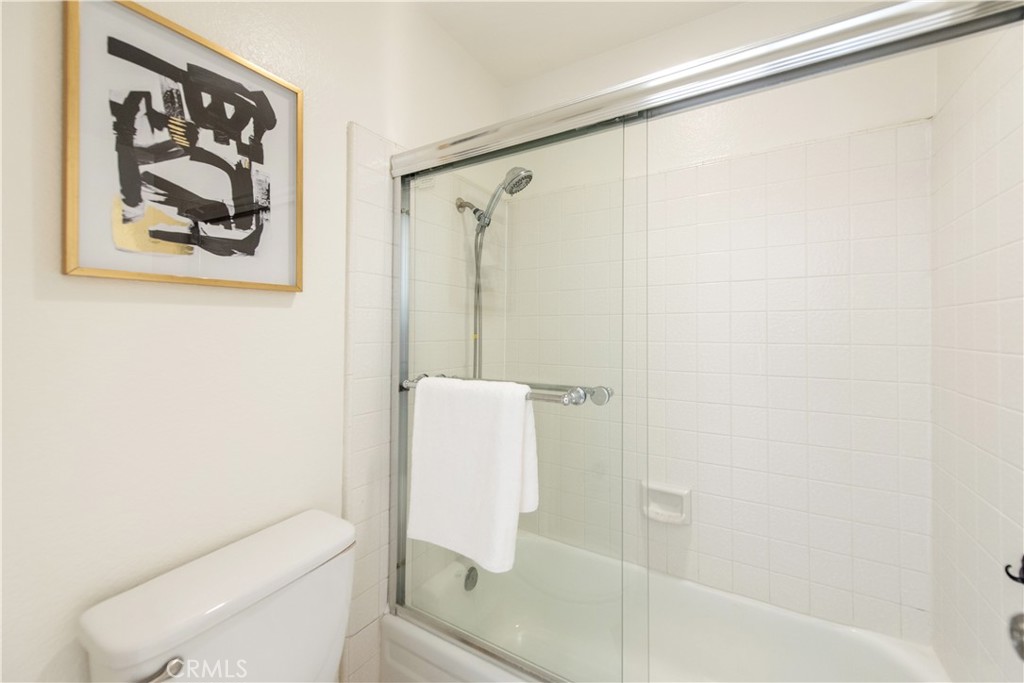28 Exeter, Unit 19 Irvine, CA 92612 - Photo 20 of 35 a bathroom with a shower and a toilet