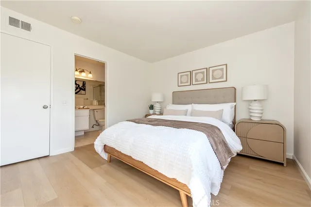 a bedroom with a bed and a couch