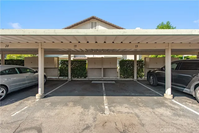 a view of a cars park in front of house