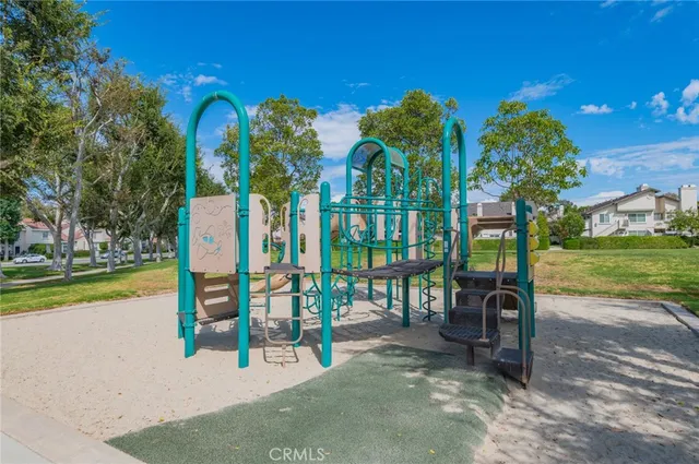 a view of a park with couches and table