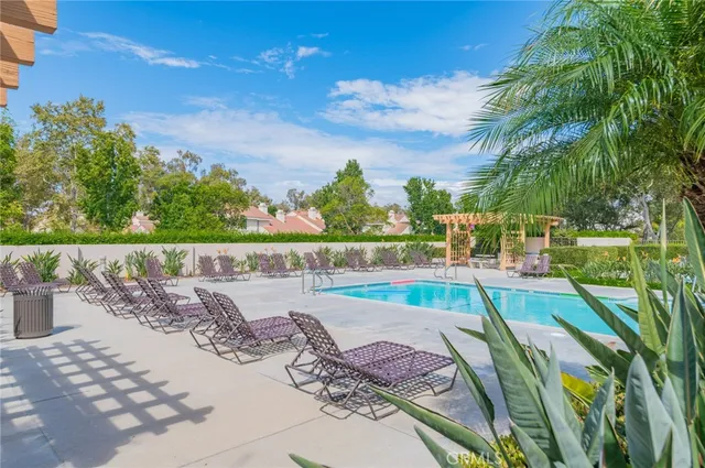 a view of a backyard with sitting area