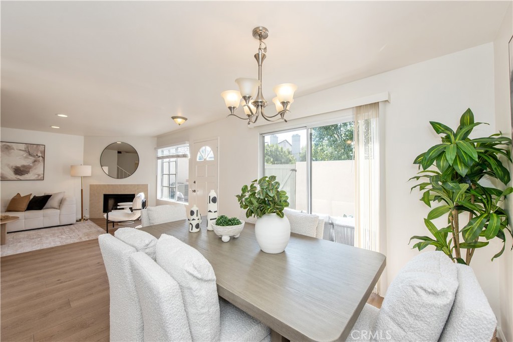 28 Exeter, Unit 19 Irvine, CA 92612 - Photo 7 of 35 a view of a dining room with furniture window and wooden floor