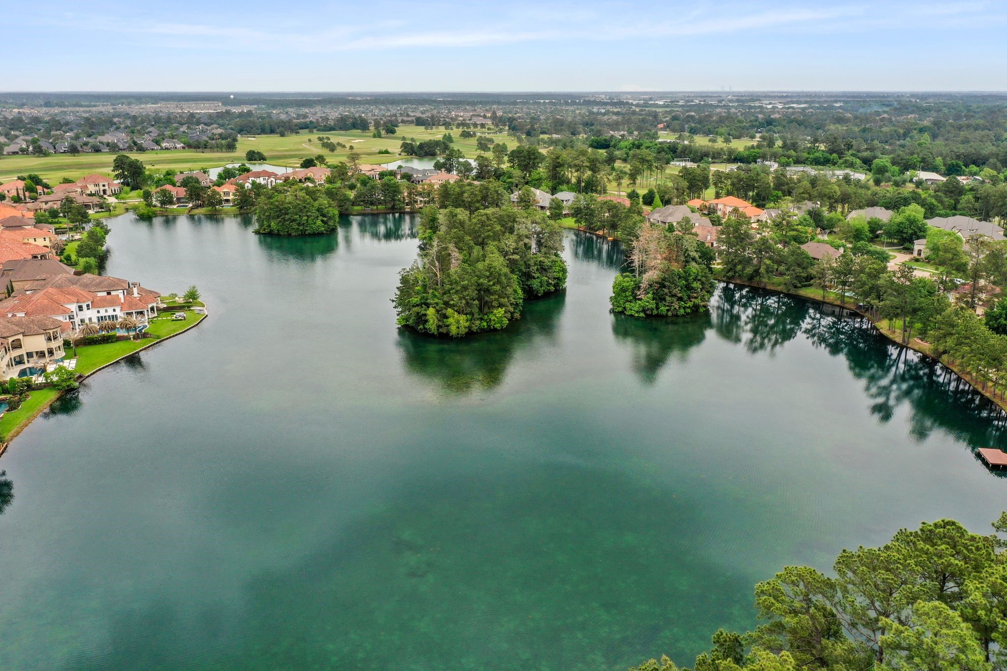 1438 Hatchmere Place Spring, TX 77379 - Photo 44 of 50 Enjoy sunrise or sunsets on the lake. Residents of GLF are free to use canoes which are available on a first come first serve basis, there is a boat house for storing the canoes.