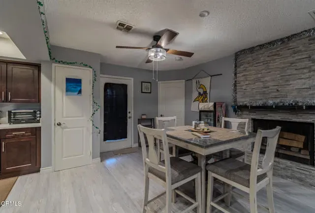 a kitchen with a table and chairs in it