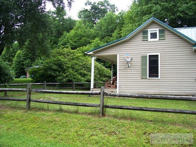 105 Misty Ridge Road Millers Creek, NC 28651 - Photo 12 of 18 a front view of a house with a yard