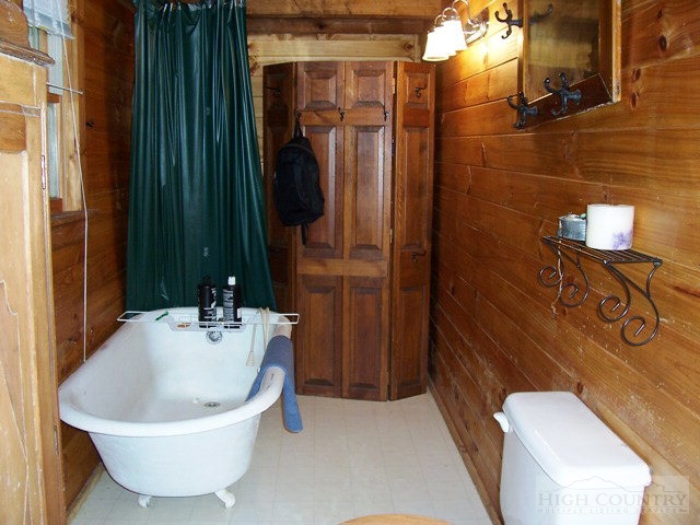 105 Misty Ridge Road Millers Creek, NC 28651 - Photo 7 of 18 a bathroom with a sink and a mirror