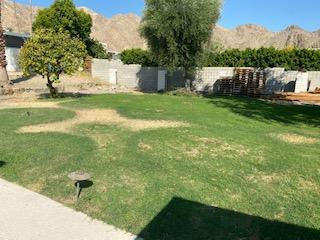 71313 Biskra Road Rancho Mirage, CA 92270 - Photo 6 of 7 a backyard of a house with table and chairs