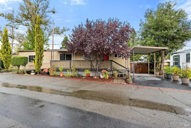 a view of a street with a couple of cars parked in front of it