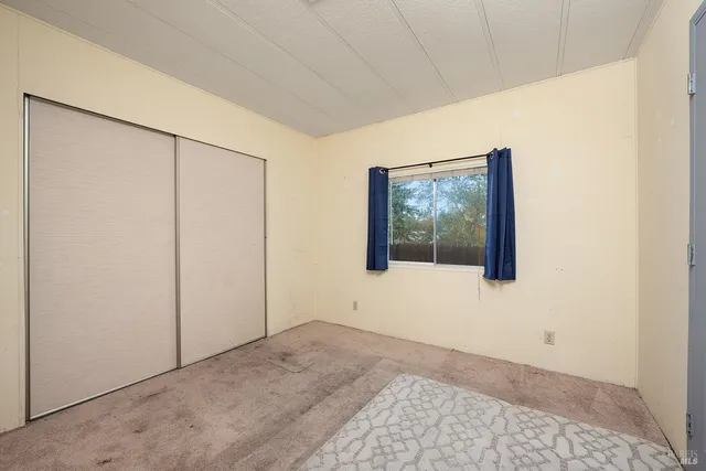 a view of a kitchen with a sink dishwasher and a fireplace