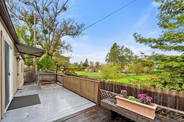 a view of a two chairs in the balcony