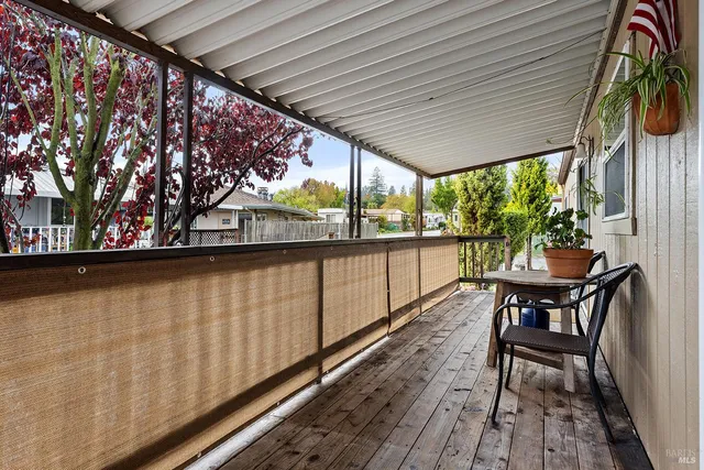a view of a balcony with chairs