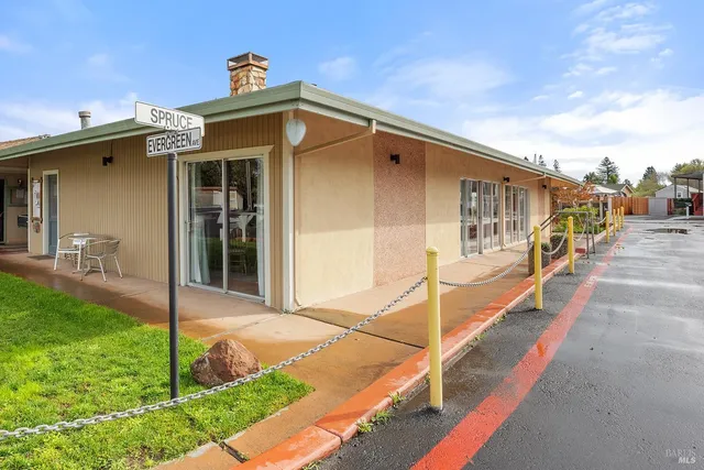 a living room with fireplace furniture and a flat screen tv