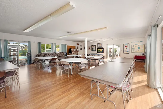 a view of a white house with swimming pool