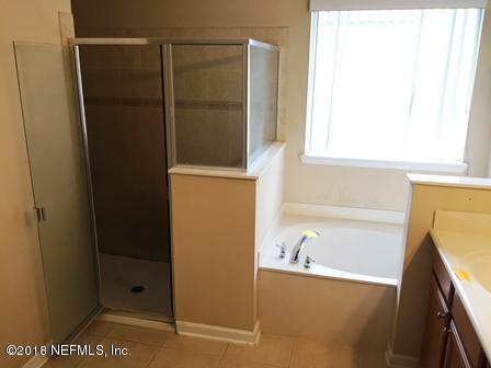 1816 Cross Pointe Way St. Augustine, FL 32092 - Photo 13 of 19 a bathroom with a bathtub and a shower