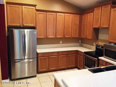 1816 Cross Pointe Way St. Augustine, FL 32092 - Photo 8 of 19 a kitchen with stainless steel appliances granite countertop a refrigerator a sink and cabinets