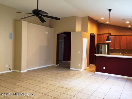 1816 Cross Pointe Way St. Augustine, FL 32092 - Photo 10 of 19 a view of a kitchen with a refrigerator and a sink