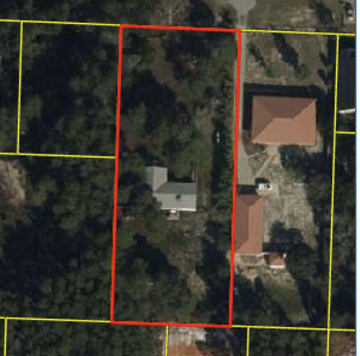 102 Walton Palm Road Inlet Beach, FL 32461 - Photo 2 of 3 a small white building with a small yard