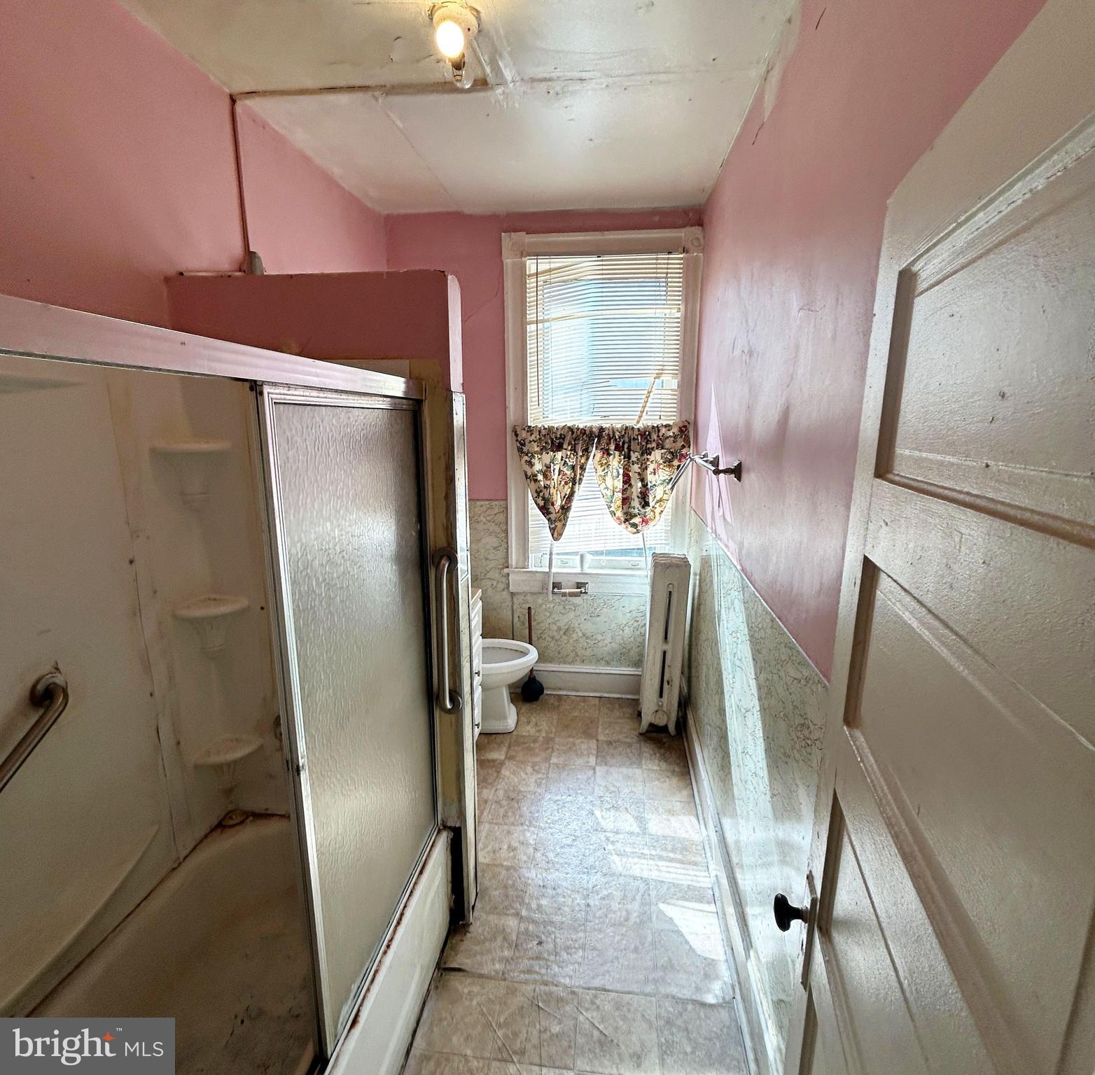 3912 Reisterstown Road Baltimore, MD 21215 - Photo 11 of 13 a kitchen with stainless steel appliances a refrigerator and a refrigerator