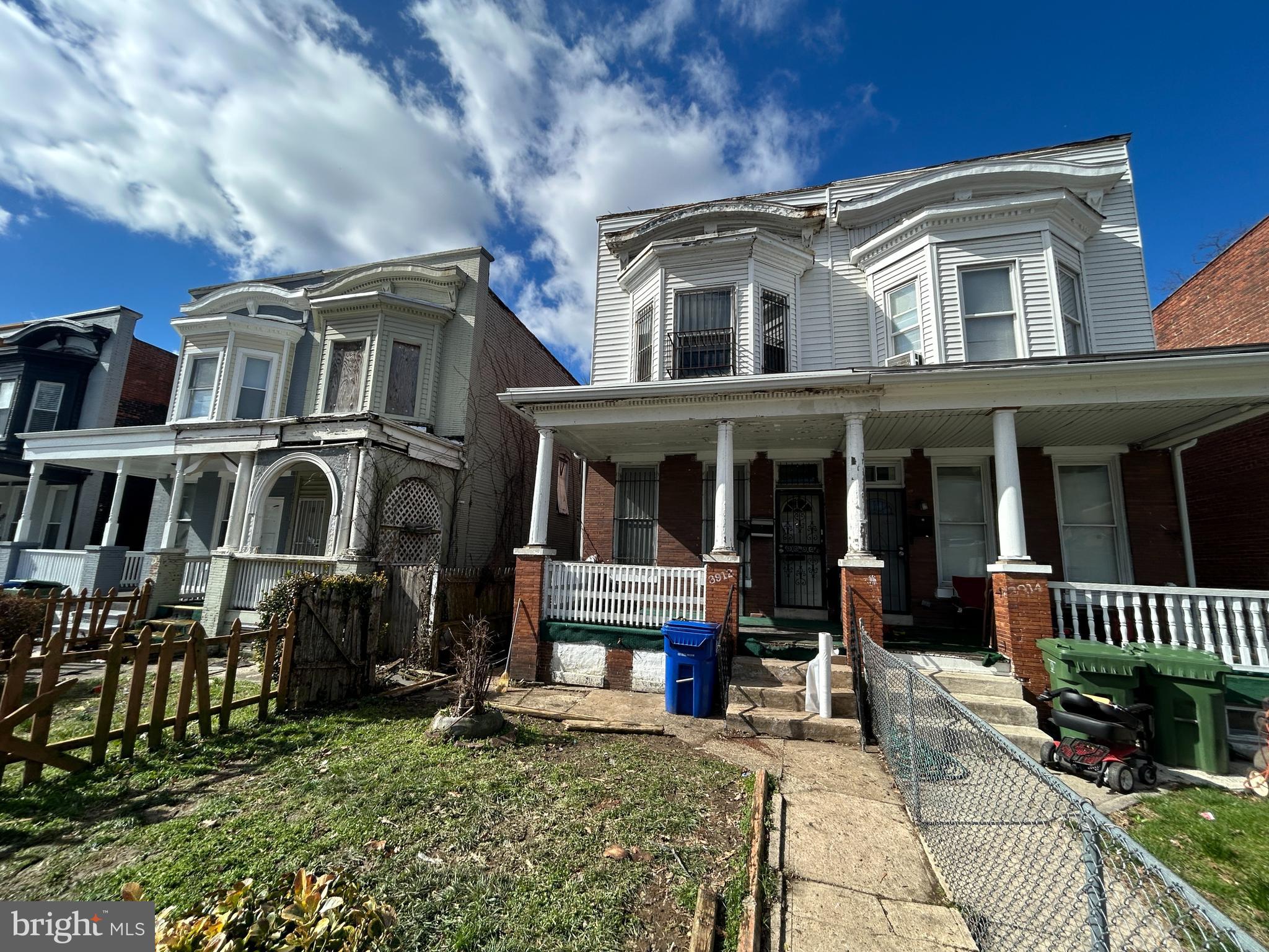 3912 Reisterstown Road Baltimore, MD 21215 - Photo 2 of 13 a front view of a house with a porch