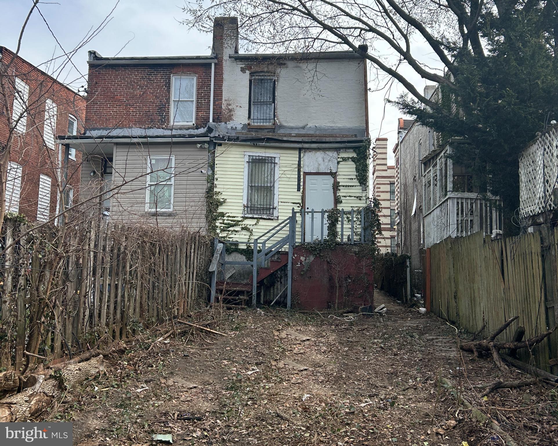 3912 Reisterstown Road Baltimore, MD 21215 - Photo 5 of 13 a view of a house with a yard and sitting area