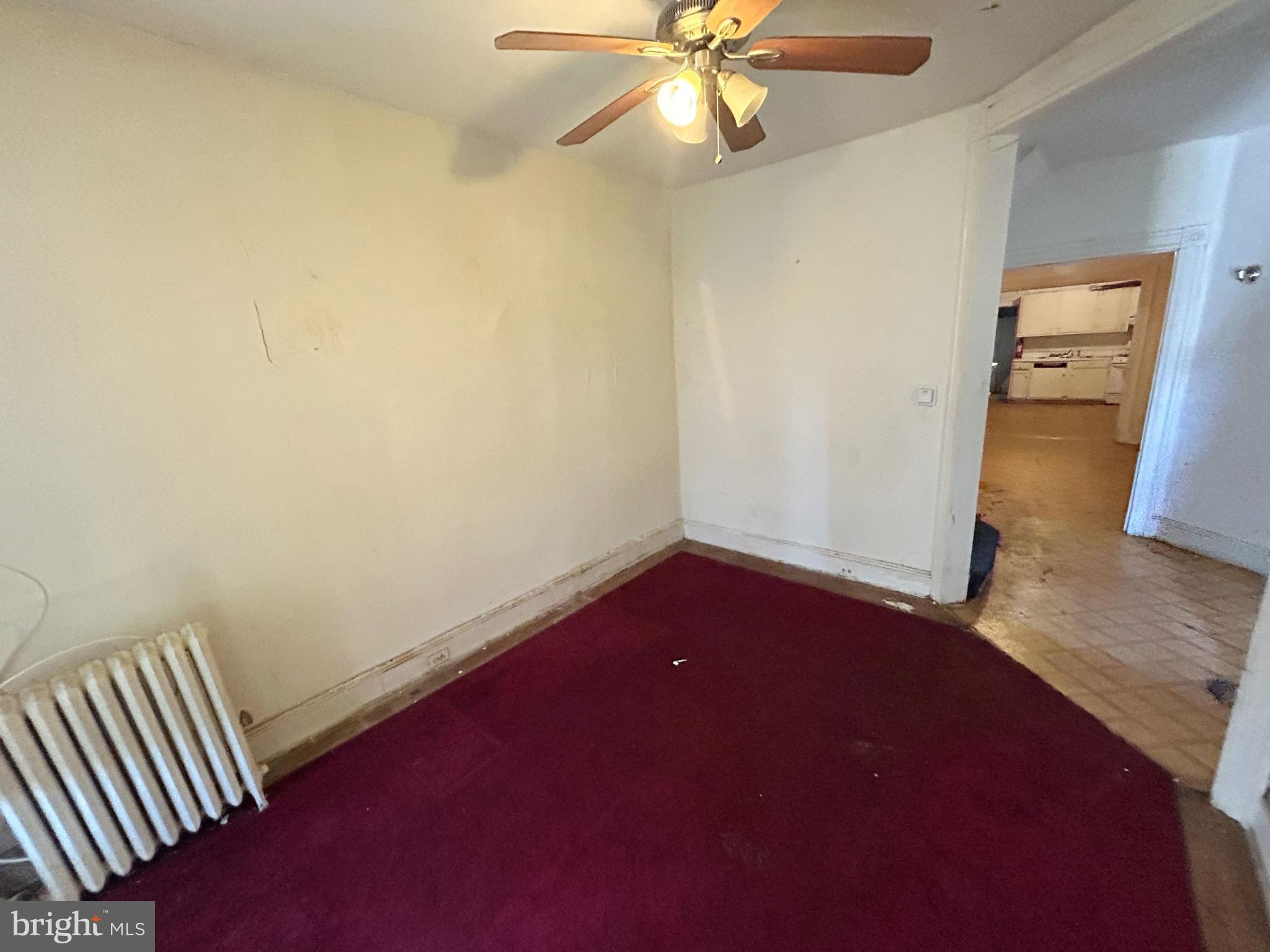 3912 Reisterstown Road Baltimore, MD 21215 - Photo 7 of 13 an empty room with a view of a bathroom